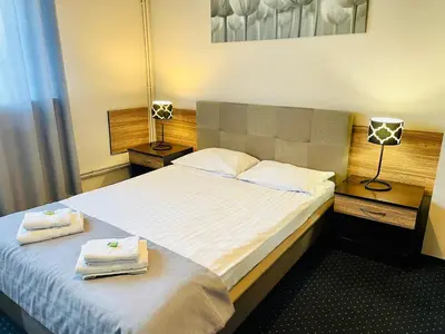 Łóżko lub łóżka w pokoju w obiekcie Hotel Seven 7