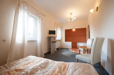 Łóżko lub łóżka w pokoju w obiekcie Gościniec Pod Furą