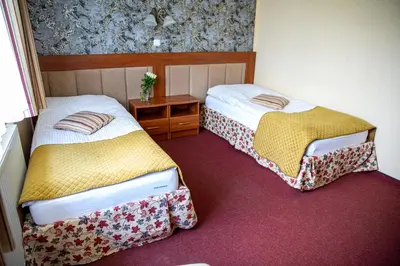 Łóżko lub łóżka w pokoju w obiekcie Hotel pod Wierzba
