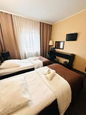 Łóżko lub łóżka w pokoju w obiekcie Rezydencja Rosato