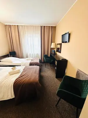Łóżko lub łóżka w pokoju w obiekcie Rezydencja Rosato