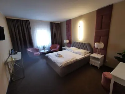 Łóżko lub łóżka w pokoju w obiekcie Rezydencja Rosato