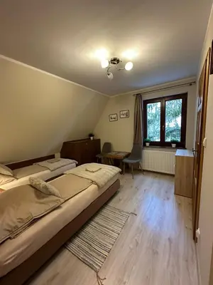 Łóżko lub łóżka w pokoju w obiekcie Apartamenty Złota Palma