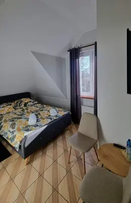 Łóżko lub łóżka w pokoju w obiekcie Zajazd Stradomia