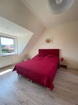 Łóżko lub łóżka w pokoju w obiekcie Słoneczne Apartamenty Polanica-Zdrój