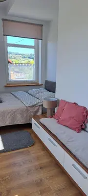 Łóżko lub łóżka w pokoju w obiekcie Apartament Bukowe Wzgórze