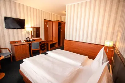 Łóżko lub łóżka w pokoju w obiekcie Premium Hotel Bacero Wrocław