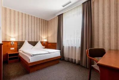 Łóżko lub łóżka w pokoju w obiekcie Premium Hotel Bacero Wrocław
