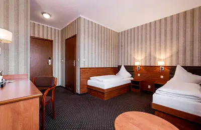 Łóżko lub łóżka w pokoju w obiekcie Premium Hotel Bacero Wrocław
