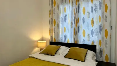 Łóżko lub łóżka w pokoju w obiekcie Mala Italia Apartments
