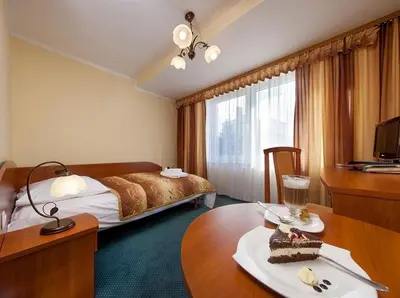 Łóżko lub łóżka w pokoju w obiekcie Willa Wolność