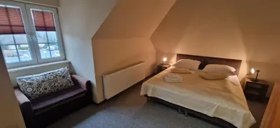 Łóżko lub łóżka w pokoju w obiekcie Tajemniczy Ogród Szczytna - Bed & Breakfast