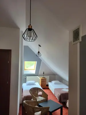 Łóżko lub łóżka w pokoju w obiekcie Apartamenty Amadeus & Trattoria Matteo e Raffaello
