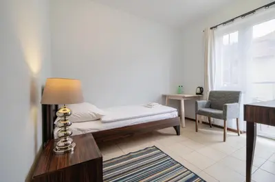 Łóżko lub łóżka w pokoju w obiekcie Villa Tilia