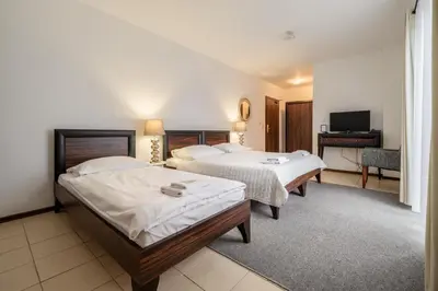 Łóżko lub łóżka w pokoju w obiekcie Villa Tilia