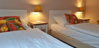 Łóżko lub łóżka w pokoju w obiekcie Gościniec Nowa Wioska