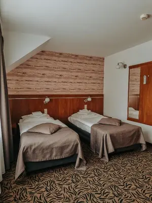 Łóżko lub łóżka w pokoju w obiekcie Hotel Azyl