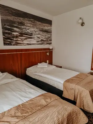 Łóżko lub łóżka w pokoju w obiekcie Hotel Azyl