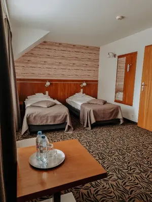 Łóżko lub łóżka w pokoju w obiekcie Hotel Azyl