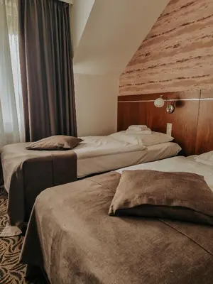 Łóżko lub łóżka w pokoju w obiekcie Hotel Azyl