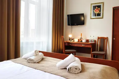 Łóżko lub łóżka w pokoju w obiekcie Hotel Lothus
