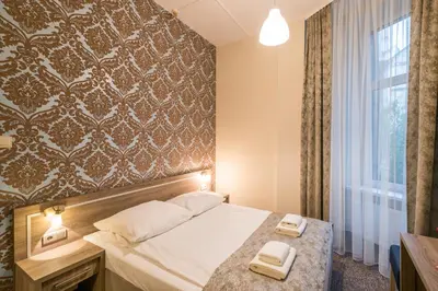 Łóżko lub łóżka w pokoju w obiekcie Hotel Lothus