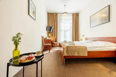 Łóżko lub łóżka w pokoju w obiekcie Hotel Lothus