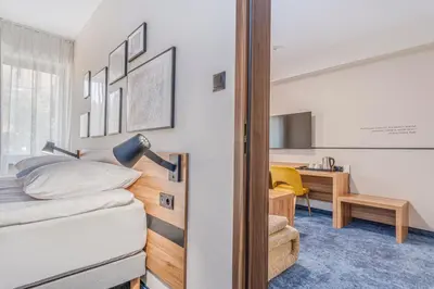 Łóżko lub łóżka w pokoju w obiekcie Tulip Hotels - Wroclaw Centre
