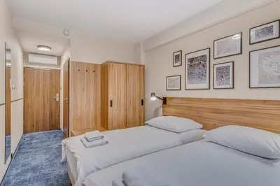 Łóżko lub łóżka w pokoju w obiekcie Tulip Hotels - Wroclaw Centre