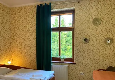 Łóżko lub łóżka w pokoju w obiekcie Hotel i Restauracja Castle