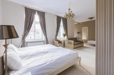 Łóżko lub łóżka w pokoju w obiekcie Hotel Fryderyk