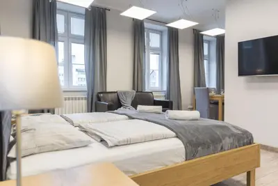 Łóżko lub łóżka w pokoju w obiekcie Apartament pod Twierdzą