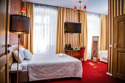 Łóżko lub łóżka w pokoju w obiekcie Hotel Nysa