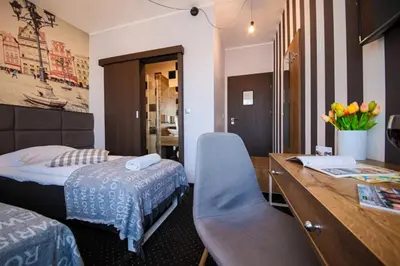 Łóżko lub łóżka w pokoju w obiekcie Boogie ApartHouse Old Town