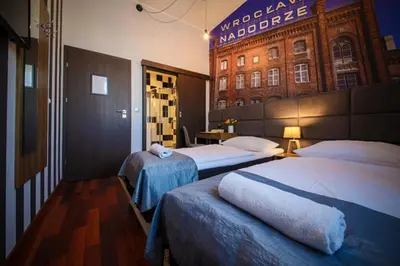 Łóżko lub łóżka w pokoju w obiekcie Boogie ApartHouse Old Town