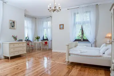 Łóżko lub łóżka w pokoju w obiekcie Pałac w Orli - pokoje, restauracja