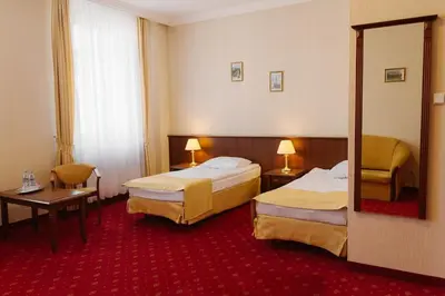 Łóżko lub łóżka w pokoju w obiekcie Hotel Jakub Sobieski