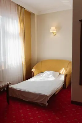 Łóżko lub łóżka w pokoju w obiekcie Hotel Jakub Sobieski
