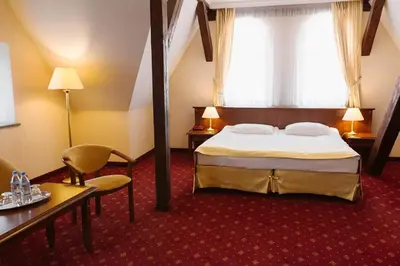 Łóżko lub łóżka w pokoju w obiekcie Hotel Jakub Sobieski
