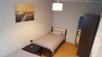 Łóżko lub łóżka w pokoju w obiekcie Sand Apartment