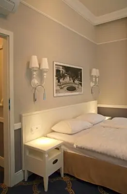 Łóżko lub łóżka w pokoju w obiekcie Willa Mała Pieniawa