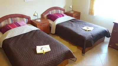 Łóżko lub łóżka w pokoju w obiekcie Villa Paradiso