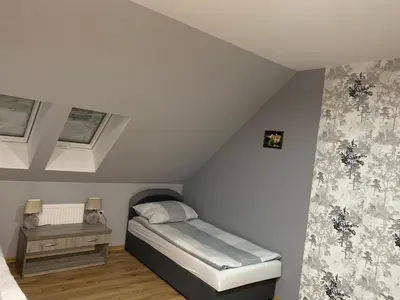 Łóżko lub łóżka w pokoju w obiekcie Zajazd Zachęta