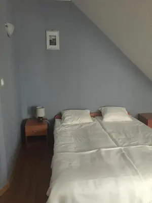 Łóżko lub łóżka w pokoju w obiekcie Zajazd Zachęta