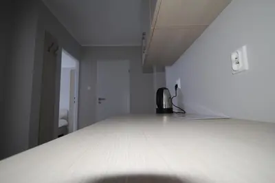 Łóżko lub łóżka w pokoju w obiekcie Pod Kominem Pokoje i Apartamenty