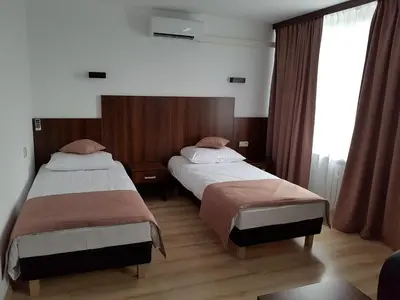 Łóżko lub łóżka w pokoju w obiekcie Pod Kominem Pokoje i Apartamenty