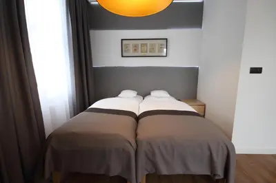 Łóżko lub łóżka w pokoju w obiekcie Apartamenty Ołtaszyńska