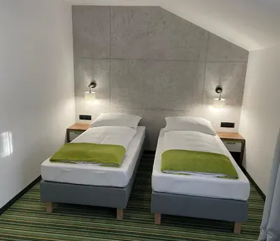 Łóżko lub łóżka w pokoju w obiekcie Kompleks Taaka Ryba