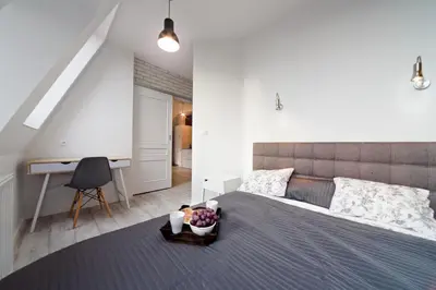 Łóżko lub łóżka w pokoju w obiekcie Apartamenty River View od WroclawApartament-pl
