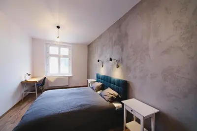 Łóżko lub łóżka w pokoju w obiekcie Apartamenty River View od WroclawApartament-pl
